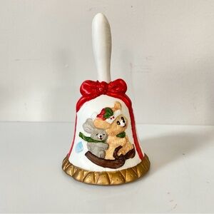 Vintage Christmas themed bell with a Bear and Rabbit on a sled.